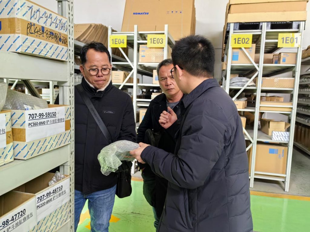 Discussing spare parts during a warehouse visit